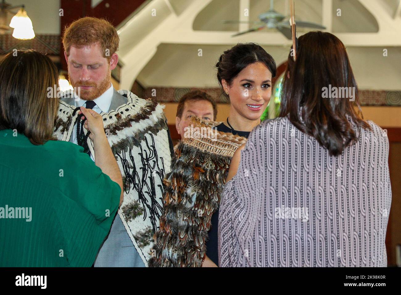 The Duke and Duchess of Sussex receive traditional cloaks at Saint Faith`s Church on Te Papaiouru marae in Rotorua, New Zealand during a three-week to Stock Photo